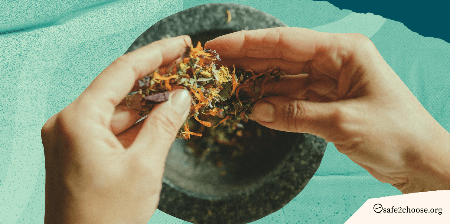 A person using traditional herbs